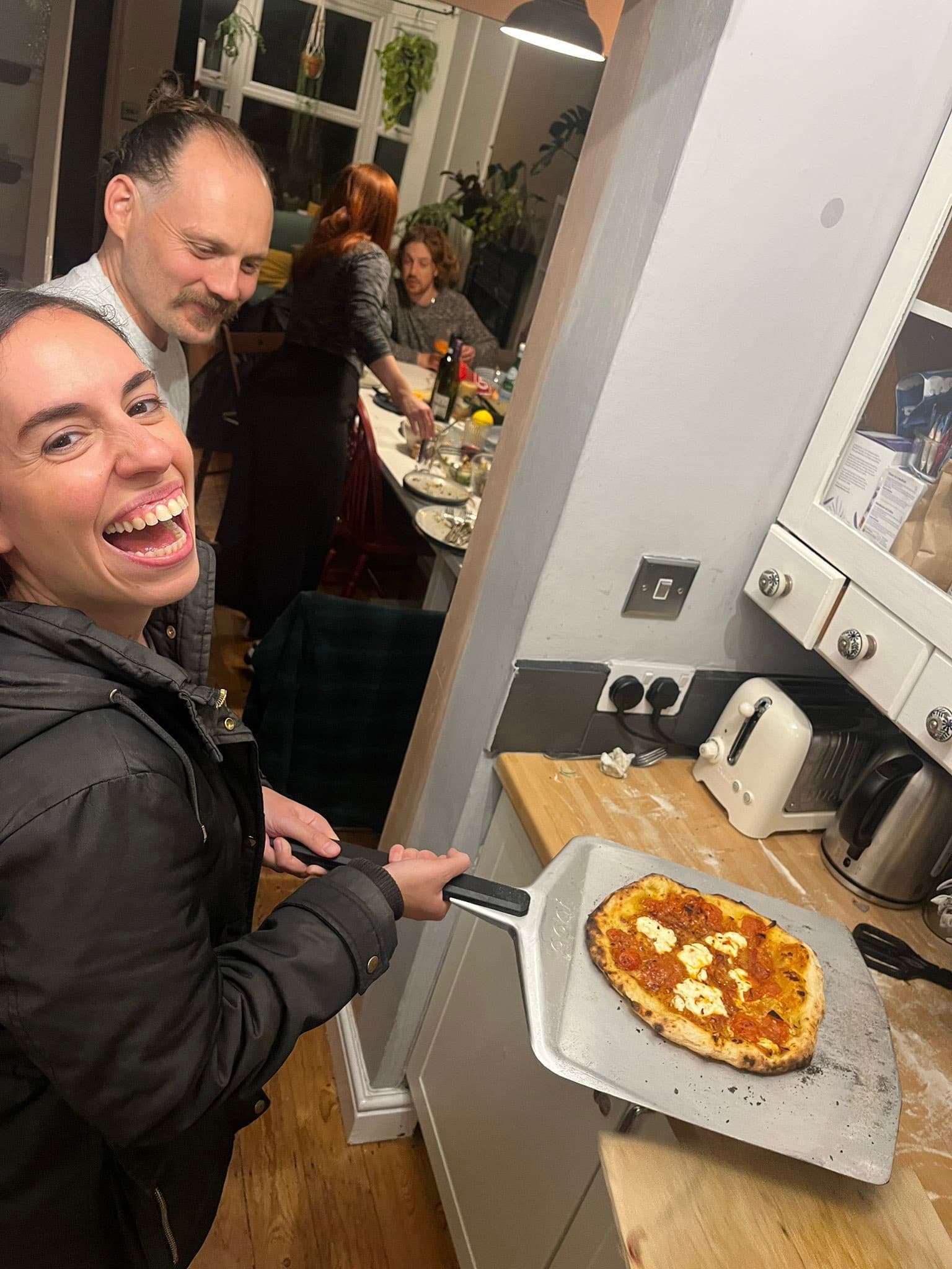 Long table from the side, guests chatting